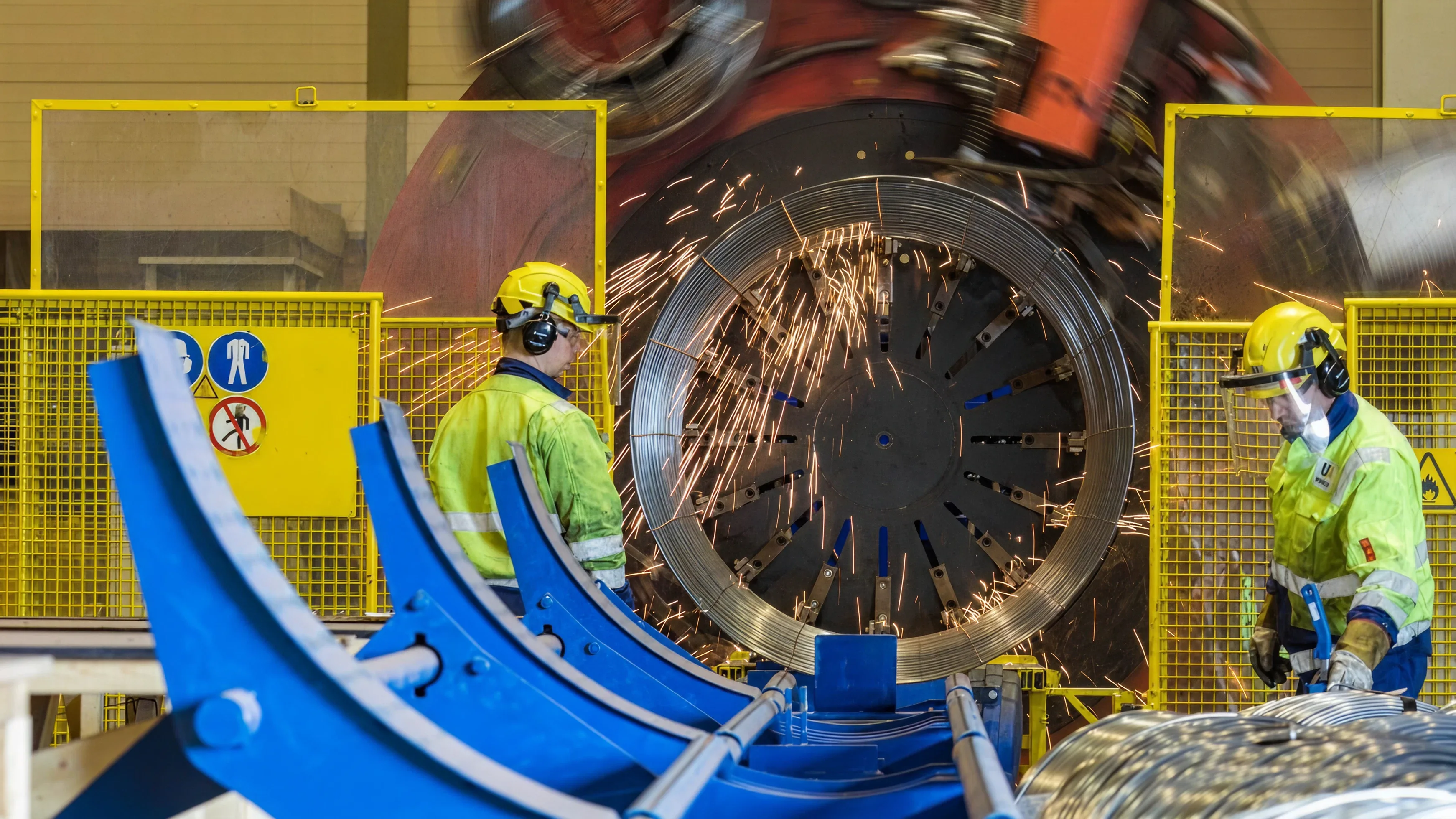 Workers manufacturing with welding sparks