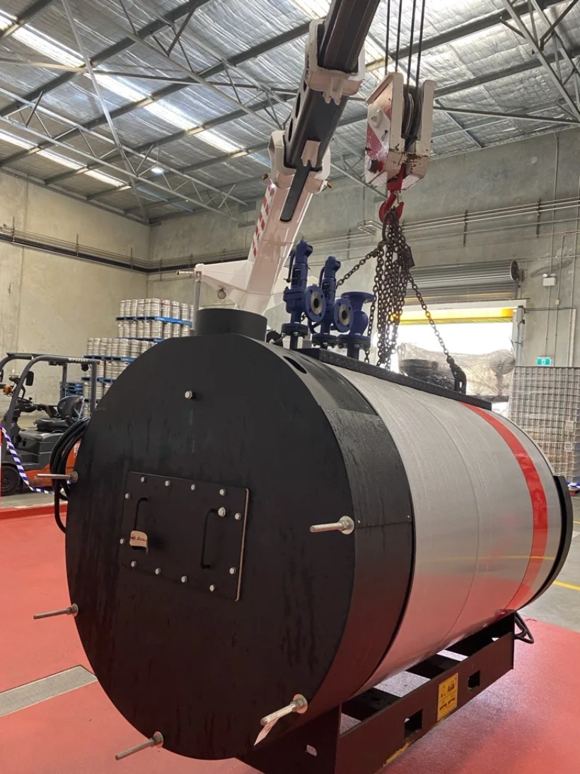 Boiler vessel lifted into the brewery by crane